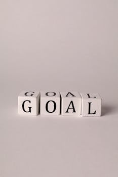 Manifestation Visualization - Simple motivation concept with 'Goal' spelled on white cubes against a neutral background.