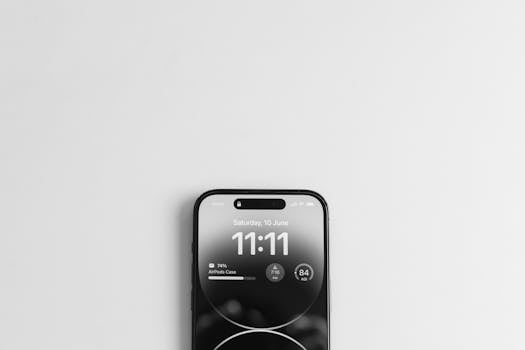 How to Connect to your Spirit Guides - Top view of a smartphone displaying the time 11:11, on a minimalist white background.