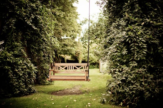 How to remove negative energy - A tranquil wooden swing hanging in a verdant garden setting, ideal for relaxation.