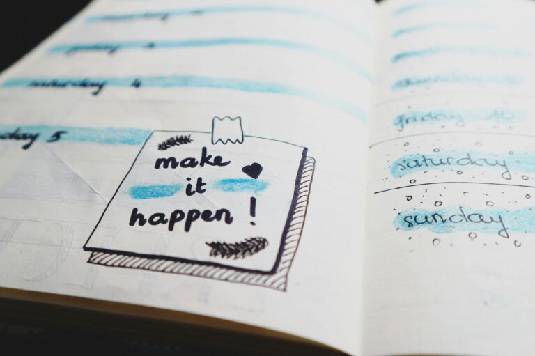 About Close-up view of a planner page with motivational text and colorful designs.