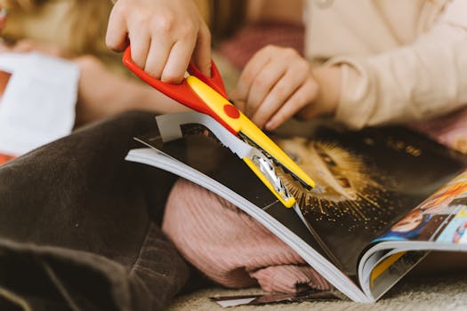 How to Create a Vision Board for Manifestation Effectively How to Create a Vision Board for Manifestation - Close up of a child using scissors to cut a magazine page for craft.