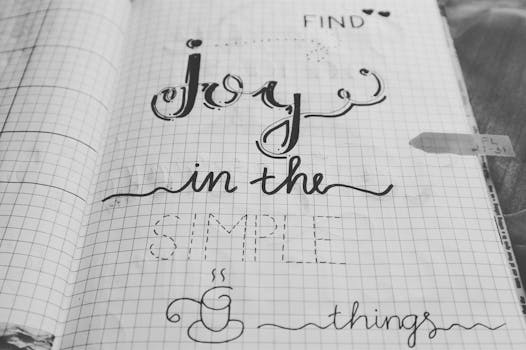 Manifestation Journaling: How to Apply and Key Methods Manifestation Journaling - Black and white image of a handwritten inspirational quote on a notebook page.