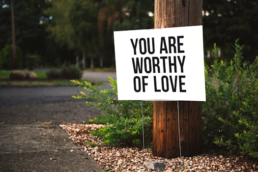 Manifestation for Love: How to Attract the Perfect Partner Manifestation for Love - A positive message sign "You are worthy of love" in a park setting.
